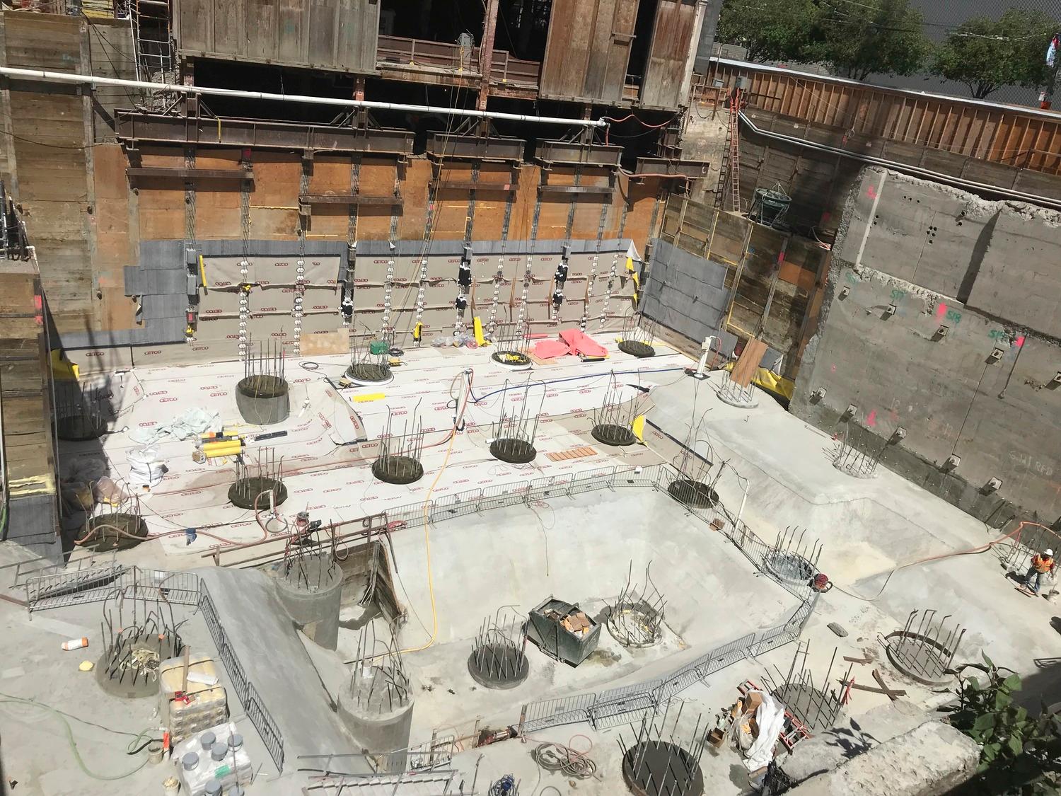 Foundation work inside a deep urban excavation