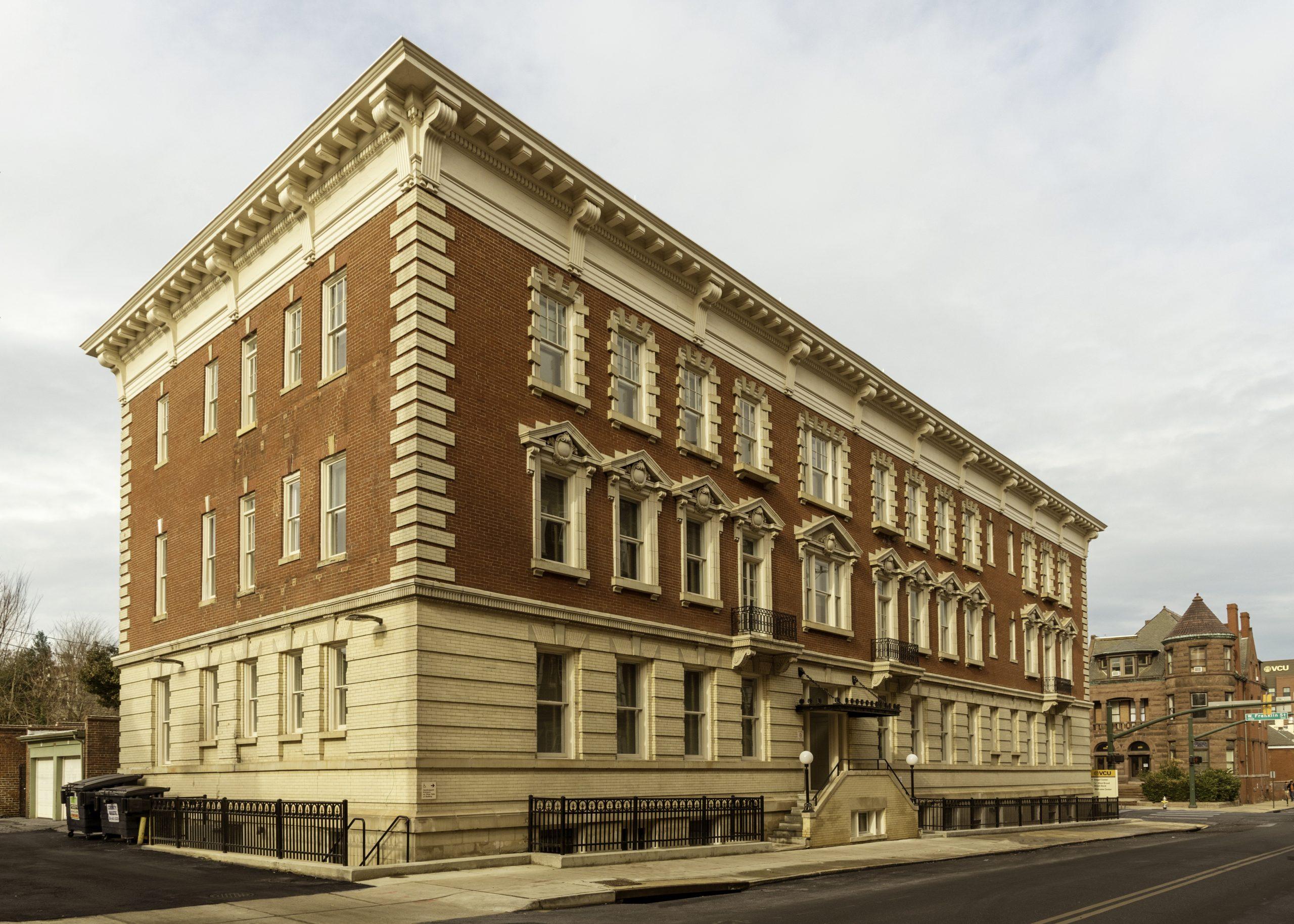 Existing brick building with a carefully ordered masonry facade