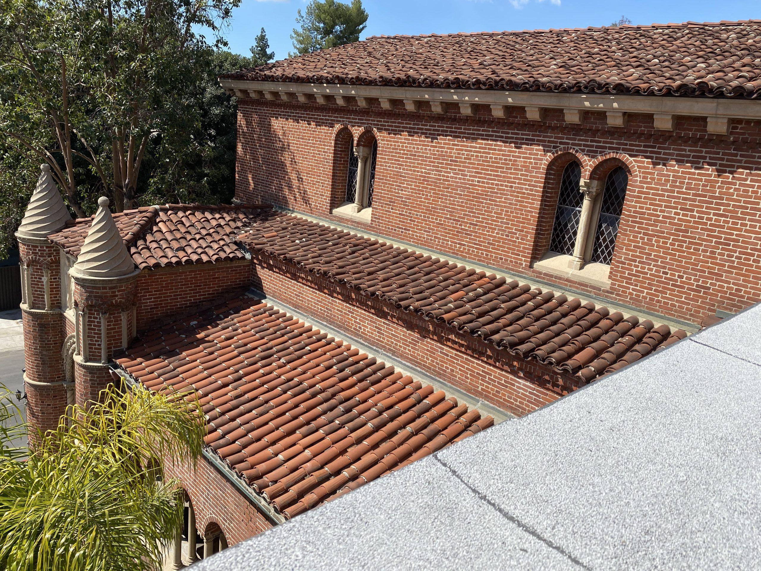 Historic red-brick community building around an enclosed courtyard